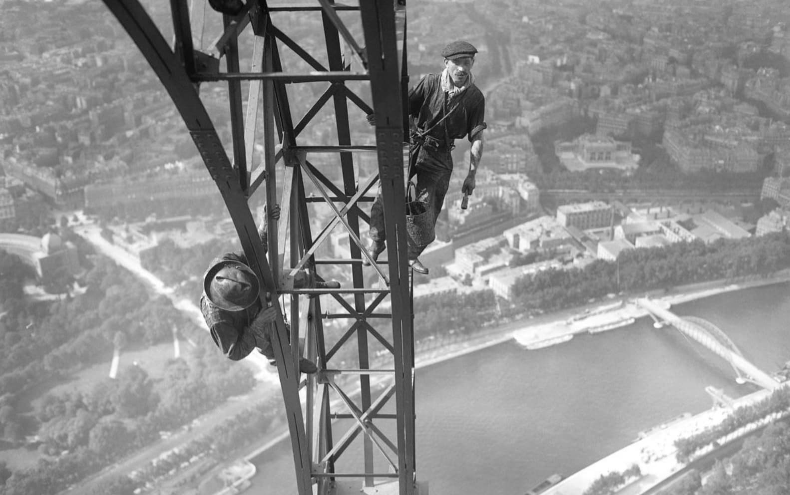 people painting the eiffel tower